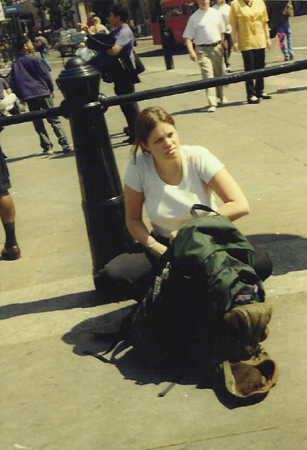 Heather taking a break with her big back pack in Trafalgar Square