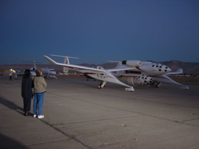 Brian Binnie's wife and Mike Melvill's wife look on as White Knight / SpaceShipOne gets ready