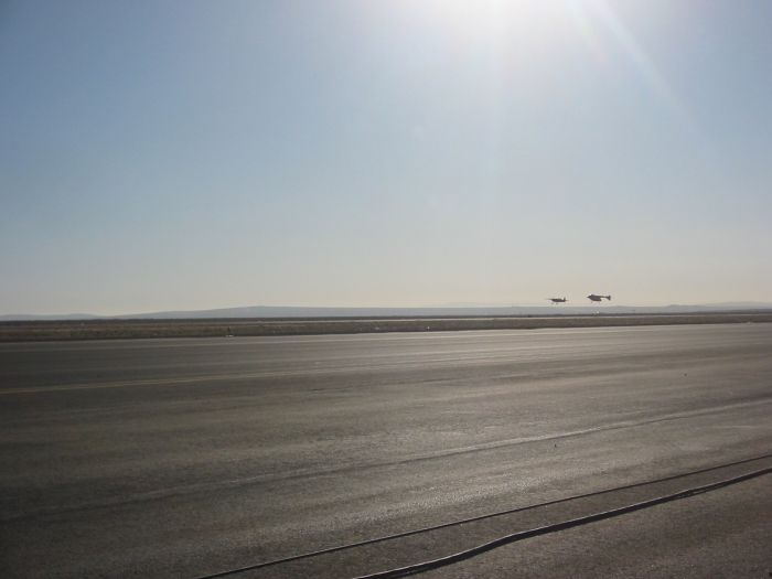 SpaceShipOne lands with Extra 300 close by keeping watch