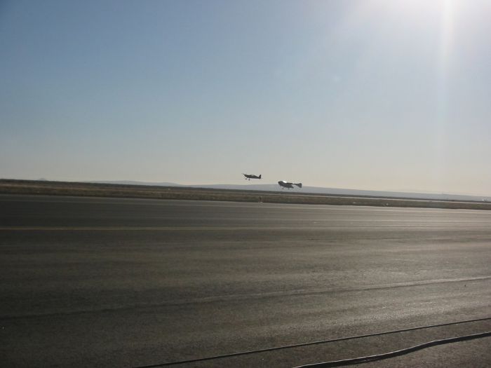 SpaceShipOne lands with Extra 300 close by keeping watch