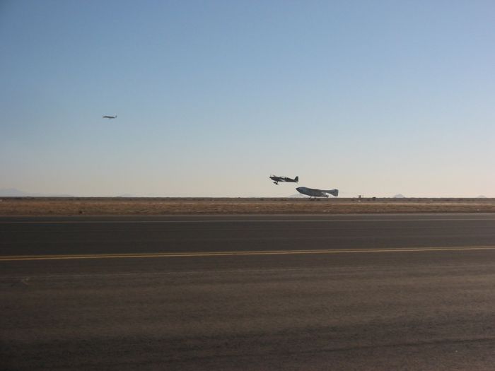 SpaceShipOne lands with Extra 300 close by keeping watch