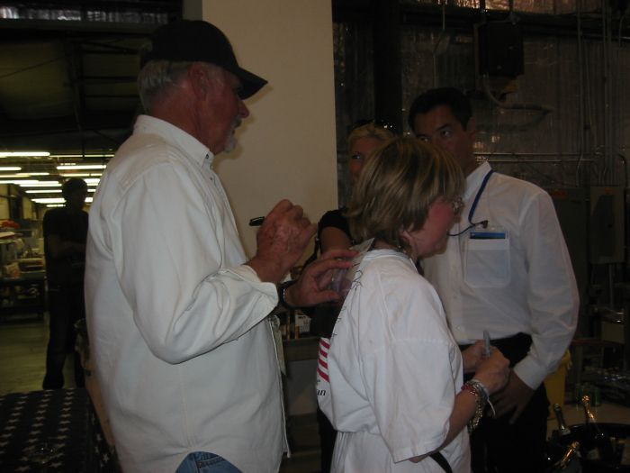 Dick Rutan signing his autograph for Nina