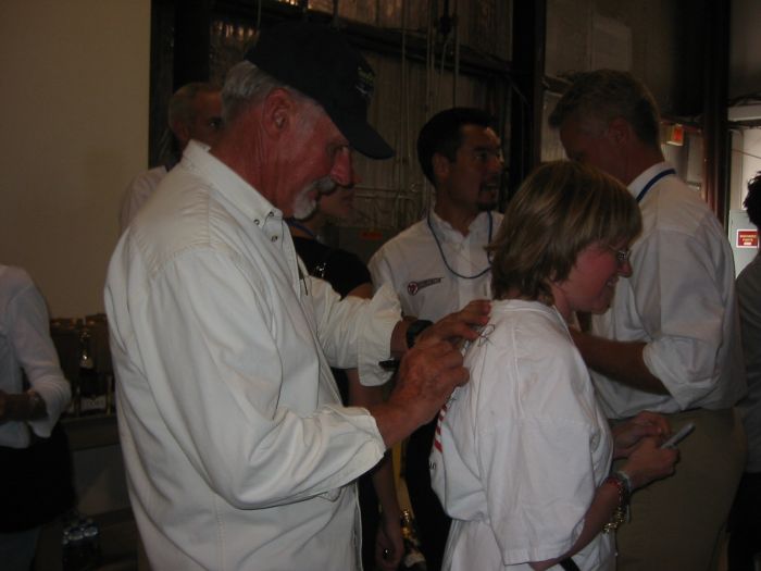 Dick Rutan signing Nina's shirt