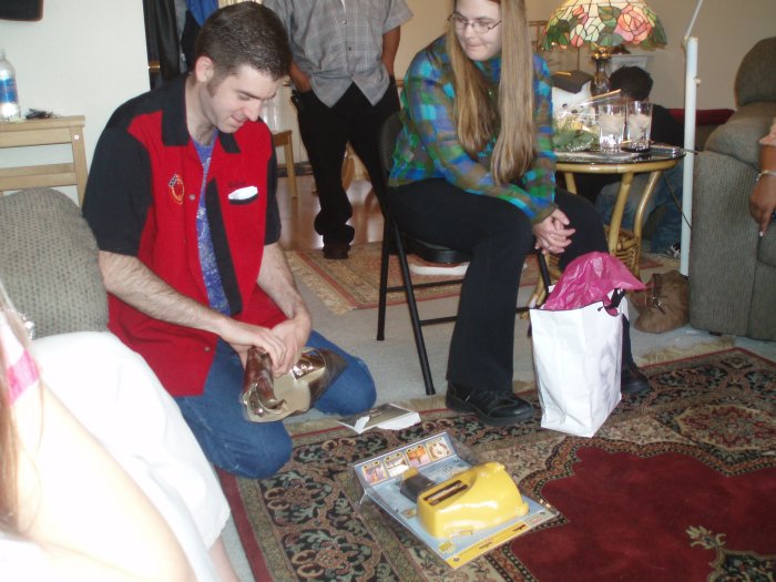 Mike opens his birthday present from my parents (his birthday was the day before)