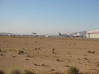 SpaceShipOne landing with Extra 300 keeping close watch