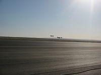 SpaceShipOne lands with Extra 300 close by keeping watch