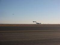 SpaceShipOne lands with Extra 300 close by keeping watch